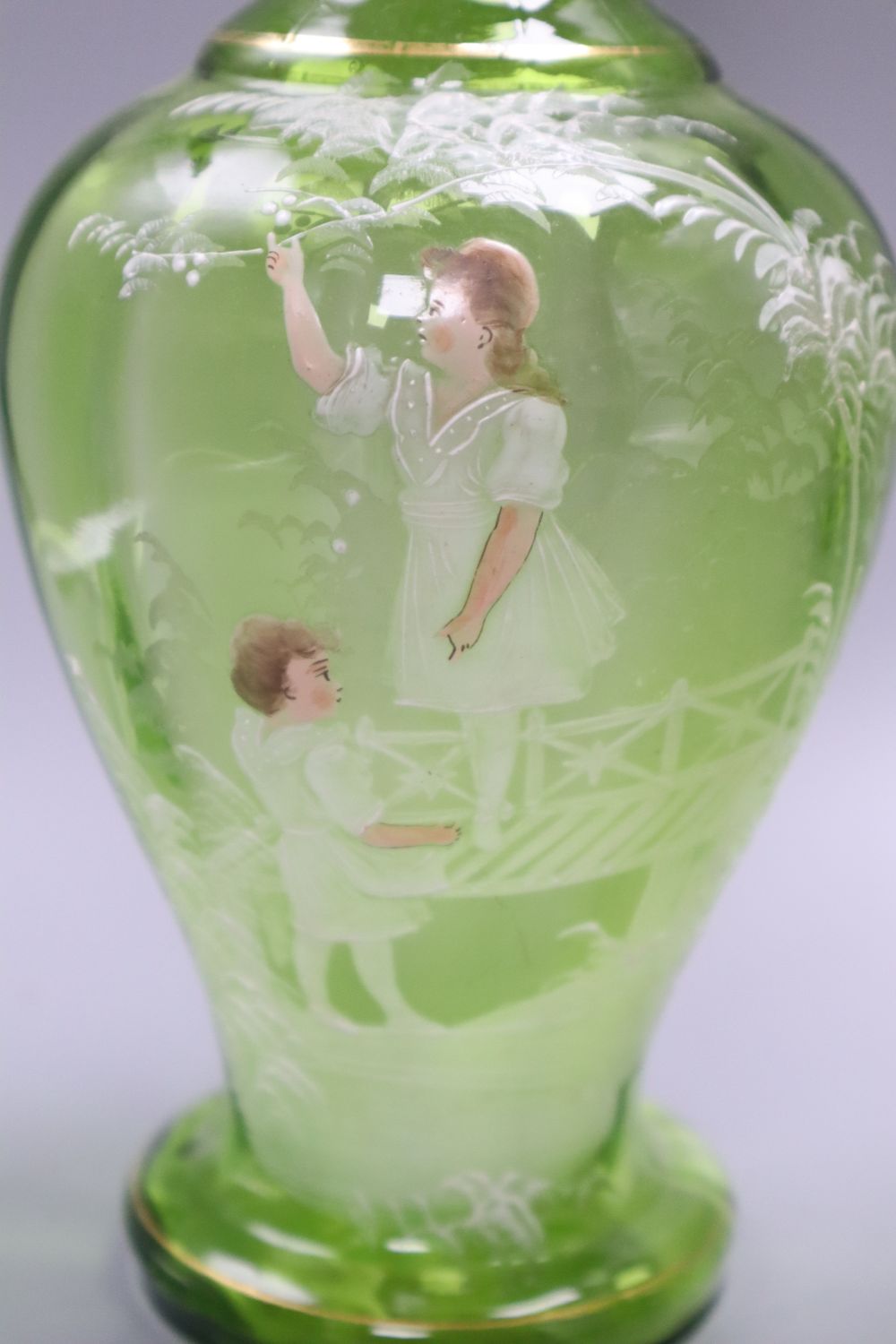 A Victorian Mary Gregory decorated green glass decanter, height 33cm and six tumblers